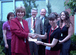 Ann presents a cheque to PDSA's Director General